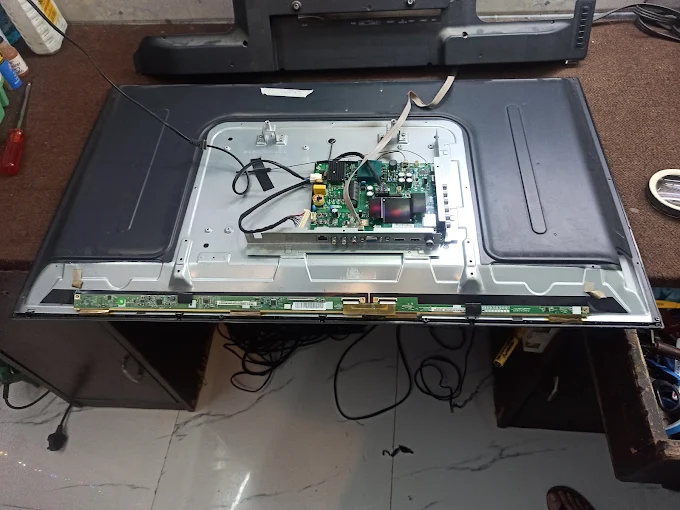 Technician repairing TV